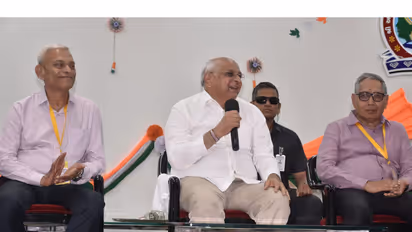 Gujarat CM Bhupendra Patel interacts with students at the Shantaben Haribhai Gajera Shaikshanik Sankul in Amreli (Photo/Gujarat CMO)