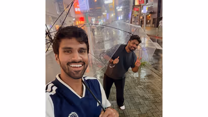 Indian cricketers Washington Sundar and Sanju Samson posing for a selfie under umbrellas (Photo: X/@Sundarwashi5)