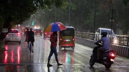 Commuters make their way during rain in Chennai (Photo/ANI)