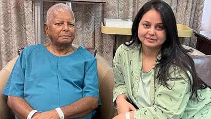 Lalu Prasad Yadav and daughter Rohini Acharya during her kidney transplant operation. (Photo/ANI)