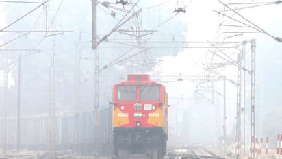 A train passes through dense fog on a cold winter morning, in Lucknow (Photo/ANI)