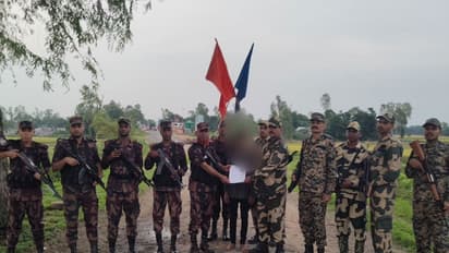 Visual of security forces along with deported Bangladeshi national (Photo/@himantabiswa/X)