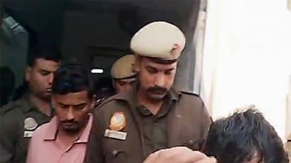 Delhi Police along with accused outside Patiala House Court (Photo/ANI)