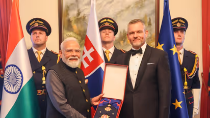Slovak President Peter Pellegrini conferres its highest honour, the Order of the White Double Cross (1st Class) on PM Narendra Modi (Photo/ANI)