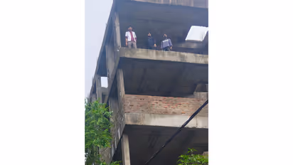 Nursing students climbed on under construction building (photo/ANI)