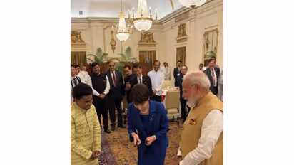 Japanese PM Sanae Takaichi attempts her hand at playing the santoor in New Delhi (Photo/Instagram/narendramodi) Inline photo/Instagram/@takaichi_sanae)