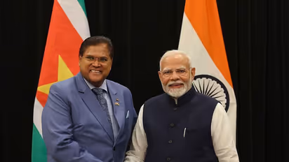 PM Modi alongwith late former Suriname President Chandrikapersad Santokhi (Photo/X/@narendramodi)