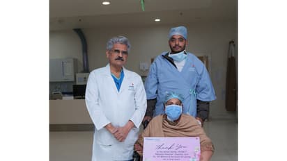 Dr. Yugal Kishore Mishra and Viji Varghese with the patient in Delhi. (Photo/ANI)