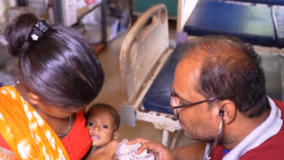 Visual of a doctor treating an infant in Sukma (Photo/ANI)