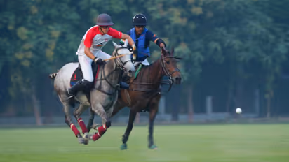 Naveen Jindal (R) swift on the ride to snatch control on the polo field. (Photo: Jindal Panther Cup)
