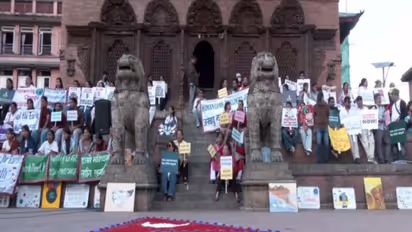 Climate justice protest and candle light vigil continues in Nepal (Photo/ANI)