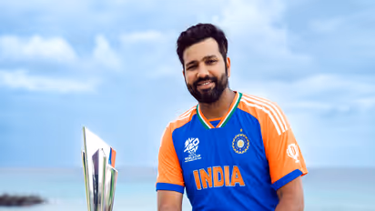 India captain Rohit Sharma with the ICC Mens T20 World Cup 2024 trophy. (Photo/ANI)