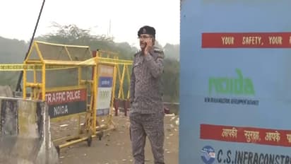 NDRF personnel at the site where Yuvraj Mehta's car fell into a water-filled pit in Greater Noida. (Photo/ANI)