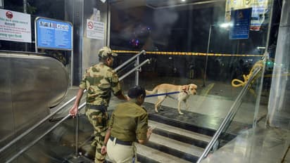 Security personnel with a sniffer dog at the Lal Quila metro station's gate no 1 (Photo/ANI)