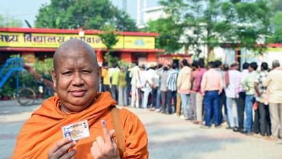 A monk shows his ink-marked finger after casting his vote in Gaya in the second phase of the Bihar assembly election (Photo/ANI)