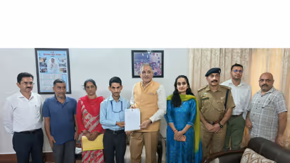 HP Governor Kavinder Gupta felicitated Sarvesh Sharma (Photo/ANI)