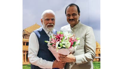 PM Narendra Modi along with late Maharashtra Deputy CM Ajit Pawar (File Photo/ANI)