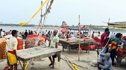 People move to safer places as monsoon rains flood Sangam area in Prayagraj (File Photo/ANI)
