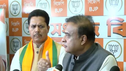 Assam CM Himanta Biswa Sarma with Bhupen Borah in Guwahati. (Photo/ANI)