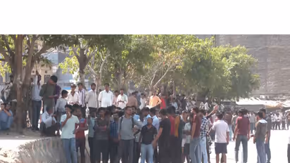 Workers protest in Noida (Photo/ANI)