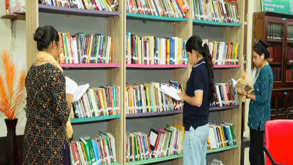 Students reading books at Rajkot District library (Photo/ANI)