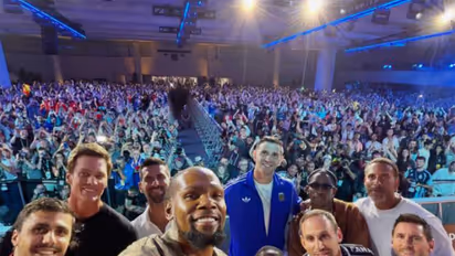 Kevin Durant takes a selfie with Lionel Messi, Tom Brady, Novak Djokovic, Kevin Hart, Emiliano Martinez, Fanatics CEO Michael Rubin, Travis Scott,Rio Ferdinand and Rodri during Fanatics Fest 2026. (Photo: Instagram/Michael Rubin)