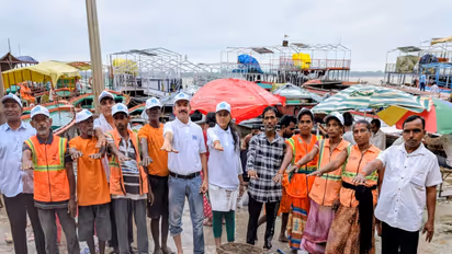 Namami Gange and Varanasi Municipal Corporation teams carry out a cleanliness drive at Dashashwamedh Ghat following the recent floods, removing more than one tonne of waste from the Ganga. (Photo: ANI)