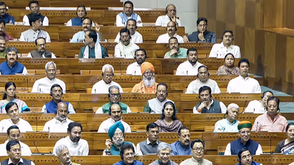 Prime Minister Narendra Modi, Union Ministers Amit Shah, Rajnath Singh, Nitin Gadkari, S Jaishankar, Piyush Goyal, Ashwini Vaishnaw, Kiren Rijiju, and others in Lok Sabha (Photo/Sansad TV)