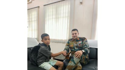 Assam Rifles personnel with the 10-year-old boy, Joseph Mao, who was rescued after going missing from Dimapur (Photo/Assam Rifles)