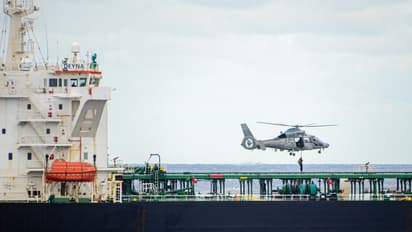 A French Navy helicopter hovers above the vessel Deyna during an interception operation targeting a suspected “ghost fleet” ship involved in sanctions evasion. (Photo: X/@EmmanuelMacron)