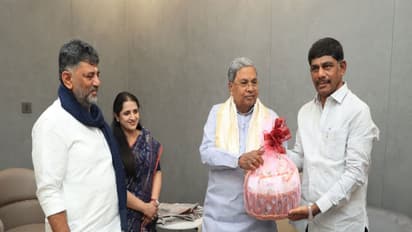 Karnataka Chief Minister D K Shivakumar, along with his wife Usha and his brother D K Suresh with former Chief Minister Siddaramaiah (Photo/Karnataka CMO)