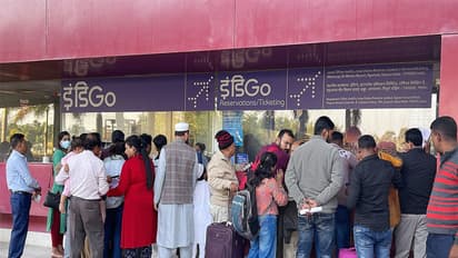 Passengers wait with their baggage as many IndiGo flight services stand cancelled (Photo/ANI)