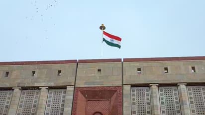A view of the National flag over the Parliament House building (File Photo/ANI)