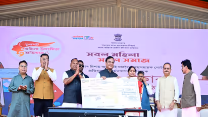 Assam CM Himanta Biswa Sarma presenting a cheque to a beneficiary under the Mukhya Mantri Mahila Udyamita Abhiyan during an event in Nagaon district (Photo/ANI)