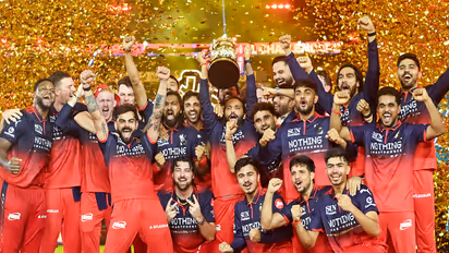 RCB players celebrating with trophy after IPL 2026 final win. (Photo/ANI)
