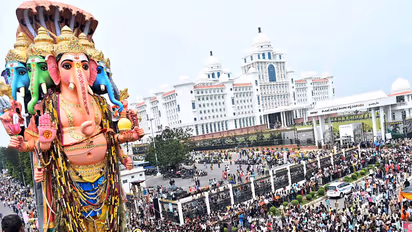 Devotees escort the 69-foot-tall Khairatabad Lord Ganesh idol towards Hussain Sagar Lake for immersion in Hyderabad (File Photo: ANI)