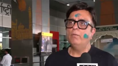 A passenger who arrived at IGI Airport from Dubai (Photo/ANI)