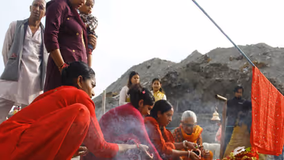 Devotees perform rituals and offer prayers using holy stones ("Shila") at the site of destroyed shrines in Devighat, Nuwakot district, following the August 26 flash flood (Photo/ANI)