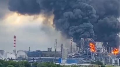 Thick plumes of smoke with flames rise from an oil refinery (Photo/X@ZelenskyyUa)