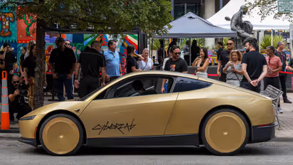 https://stocktwits.com/news-articles/markets/equity/tsla-stock-musk-hypes-cybercab-cathie-wood-ark-trillions/cZteFCIRJyX