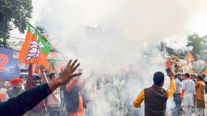 BJP supporters burst crackers to celebrate NDA's lead in the Bihar assembly election in Patna on Friday. (Photo/ANI)