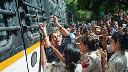 Police personnel detain a protester during a protest near Jantar Mantar, in New Delhi on Saturday (Photo/ANI)