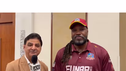 Chris Gayle (R) and West Indies Champions owner Ajay Sethi (L). (Photo/ANI)