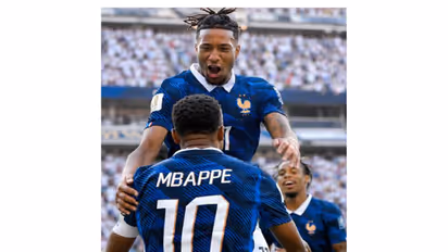 Michael Olise celebrating with Kylian Mbappe. (Photo: @equipedefrance X)