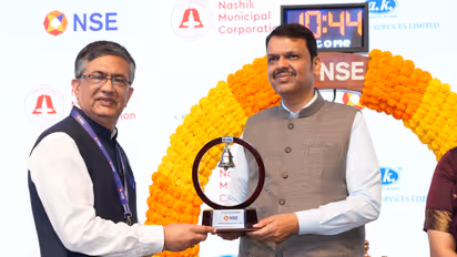 Ashish Chauhan, MD, National Stock Exchange presents a replica of the NSE Bell to Maharashtra’s Chief Minister Devendra Fadnavis (Photo/X@NSEIndia)