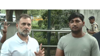 Rahul Gandhi with a youth protester (Photo/ANI)