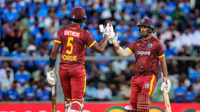 West Indies' Amir Jangoo (R) celebrates his half century with teammate Matthew Forde. (Photo/ANI)