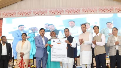 Assam CM Himanta Biswa distributing PMAY-G sanction letters (Photo/ANI)