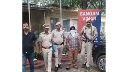 Delhi police personnel with the accused (Photo/ANI)