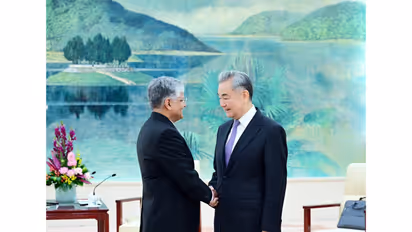 Chinese Foreign Minister Wang Yi with outgoing Indian Ambassador to China Pradeep Kumar Rawat (Photo/X@China_Amb_India)